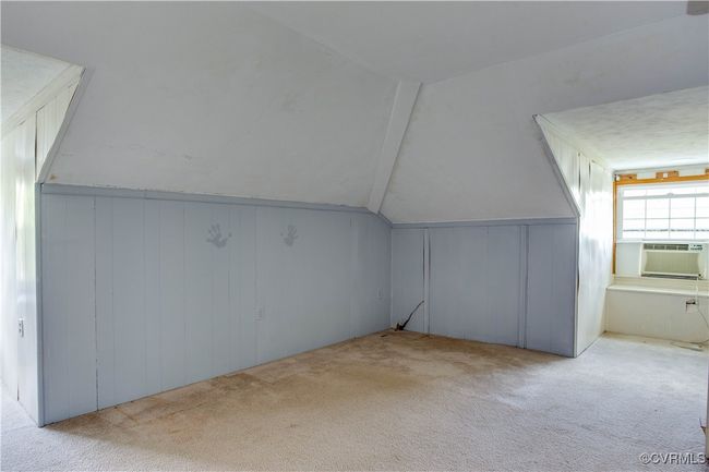 Bonus room featuring vaulted ceiling, carpet flooring, and window unit | Image 34