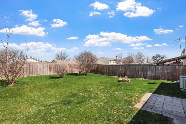 View of fenced backyard | Image 27