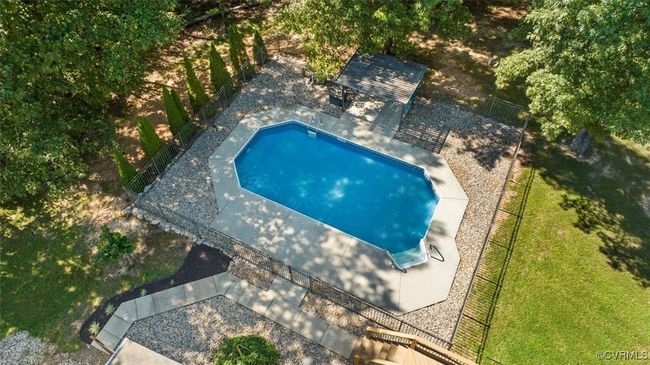 View of pool featuring a yard and a patio | Image 22