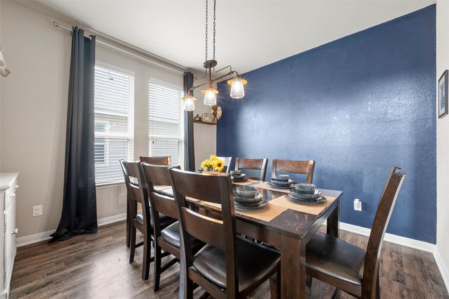 Dining area with wood finished floors and healthy amount of natural light | Image 9