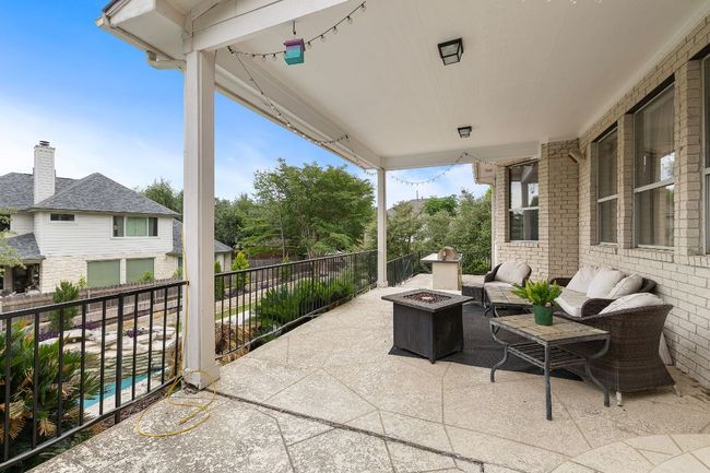 The covered patio that also is right beside the outdoor kitchen. | Image 37