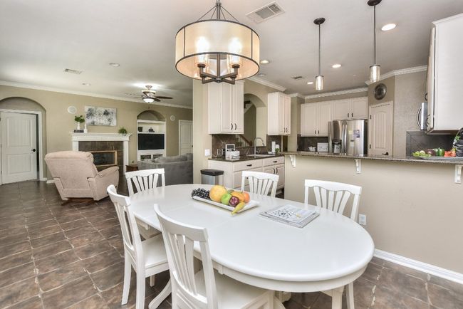 This breakfast/casual dining area offers plenty of space for a formal dining table if needed. | Image 16