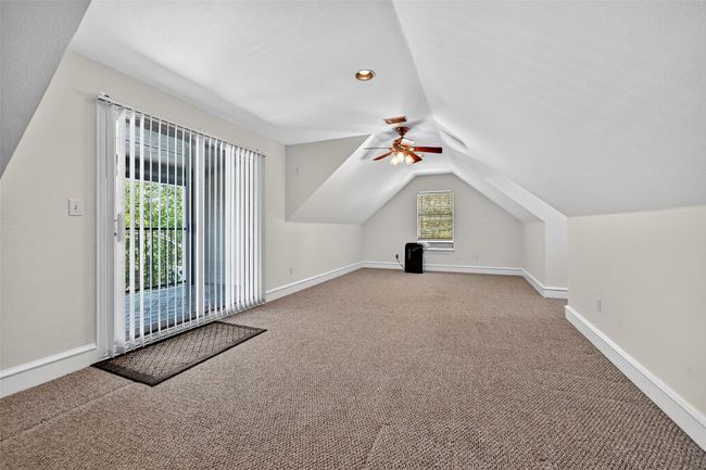 Bonus room featuring carpet, vaulted ceiling, a ceiling fan, and baseboards | Image 29