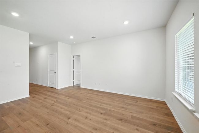 Unfurnished room with light wood-style floors and recessed lighting | Image 12