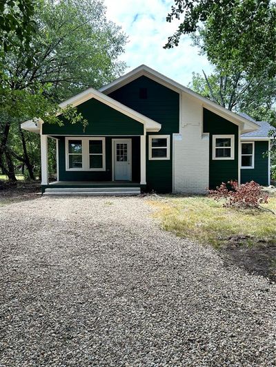 View of front of home with a porch | Image 1