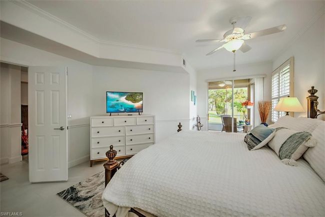 Bedroom with visible vents, ornamental molding, access to outside, and ceiling fan | Image 16