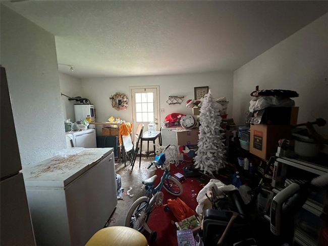 Miscellaneous room with washer and dryer and water heater | Image 14