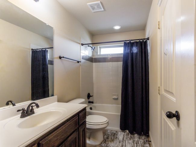 This full bathroom includes a recessed light fixture and a bathtub/shower combo. | Image 24