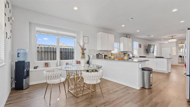 Full view of dining area and kitchen tons of natural light! | Image 14