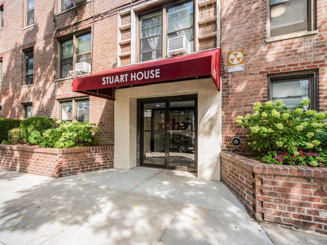 Entrance to property featuring brick siding and cooling unit | Image 13