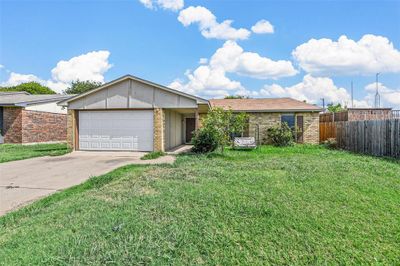 Single story home with a garage and a front yard | Image 2