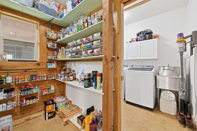 Pantry and separate laundry room with a sink and washer and dryer | Image 20