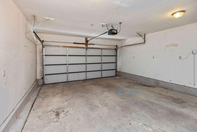 Garage with a garage door opener | Image 26