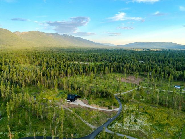 View of mountain background featuring a heavily wooded area | Image 47