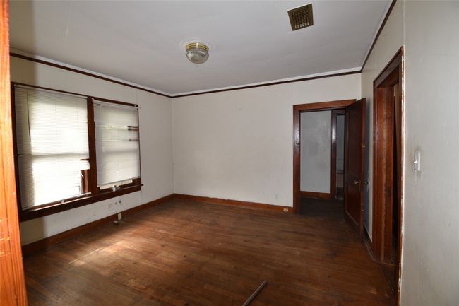 Spare room featuring wood-type flooring and ornamental molding | Image 8