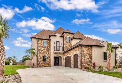 View of front of house with a garage and a front lawn | Image 2