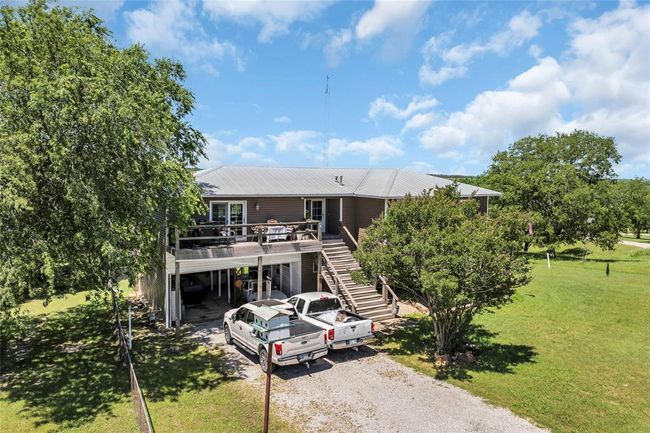View of building exterior with stairway and driveway | Image 43