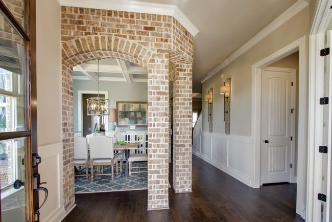 Another view of the dining room. The home features engineered hardwood in the living areas. | Image 8