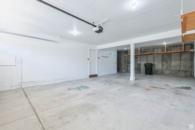 Garage with a garage door opener, freshly painted garage | Image 36