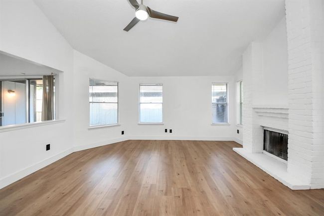Living room offers and abundance of natural light. | Image 7