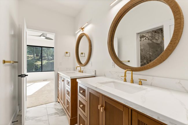 Jack & Jill Bath on second level featuring dual vanity, large shower and heated tile floor | Image 37