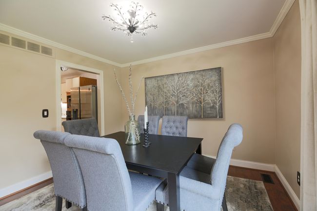 Great room with dining area situated near the spacious kitchen. | Image 5