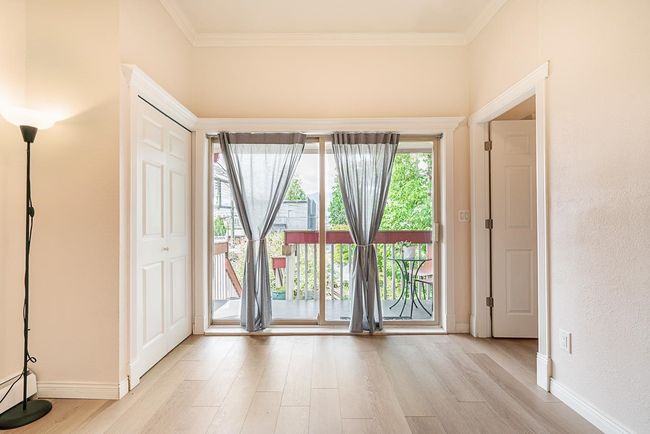 Unfurnished room with light wood-type flooring, ornamental molding, and a baseboard radiator | Image 15