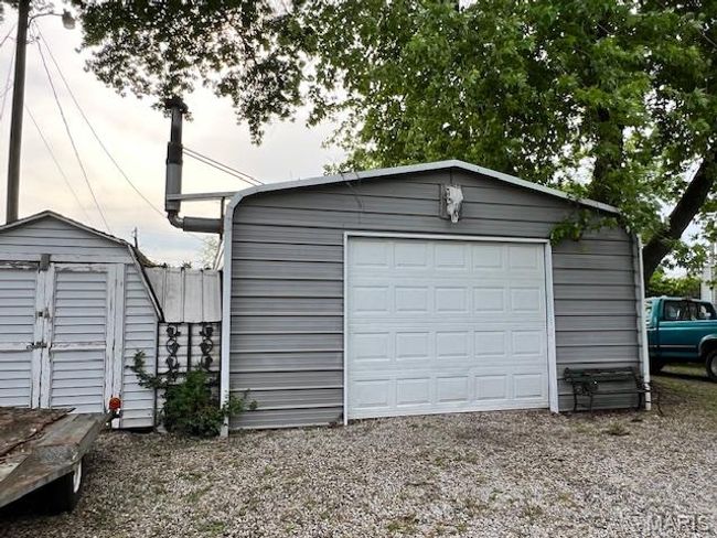 View of detached garage and shed | Image 21