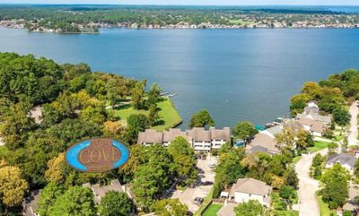 Welcome to The Cove At Walden...Picturesque waterfront lakeside lifestyle, featuring a top floor condo with rare three bedrooms and three updated baths. | Image 1