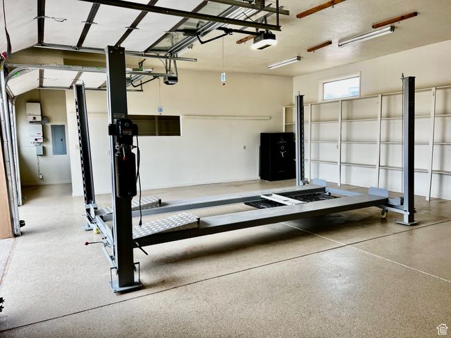 Garage with electric panel and a garage door opener | Image 55