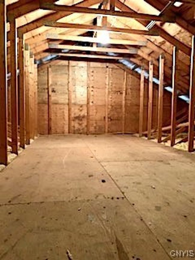 Attic above the garage with pull down stairs | Image 39
