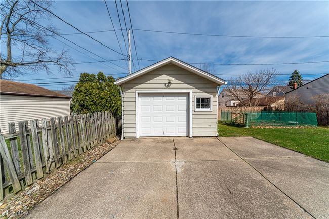 Detached garage featuring driveway | Image 38