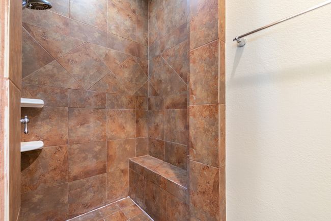 Bathroom featuring tiled shower | Image 19