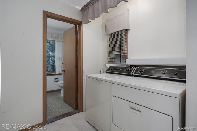 Convenient 1st floor laundry and adjacent half bath | Image 24