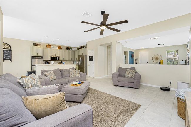 Front Family Room opens up to Kitchen and adjoining living and dining rooms at rear of home | Image 15