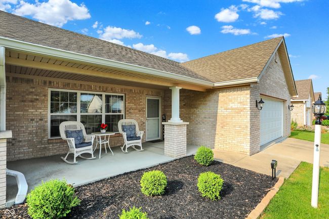 Front view of the home with a cozy porch | Image 4