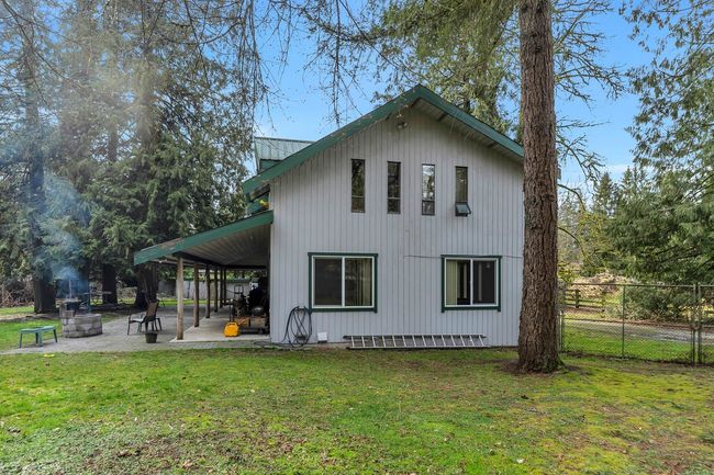 Back of property with a patio area, fence, and a lawn | Image 36