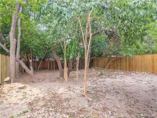 View of fenced backyard | Image 6
