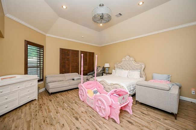 Spacious Primary Bedroom with Three Windows | Image 21