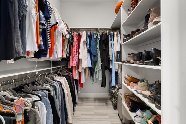 View showing one of two spacious master bedroom closets. closet | Image 22