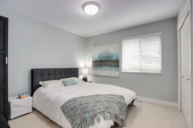Bedroom with a closet and carpet floors | Image 13