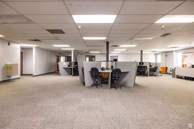 Carpeted office space with a paneled ceiling | Image 8