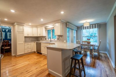 WOW! SELLERS EXPANDED THIS HOME OFF THE BACK AND INSTALLED A NEW HIGH-END KITCHEN. NOTICE THE WONDERFUL KITCHEN EAT-IN AREA FOR FAMILY MEALS, THE QUARTZ COUNTERTOPS GIVE YOU SO MUCH ROOM FOR SERVING, ENTERTAINING, OR JUST A QUICK BITE! | Image 3