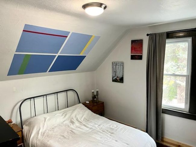 The other half of the main bedroom. There is a spacious closet behind the wall. The hardwood flooring could be refinished. | Image 19