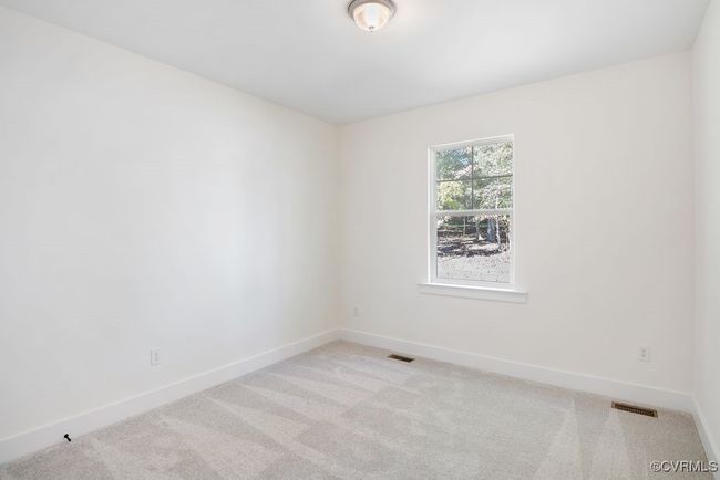Photo represents the plan, not the actual home. Design selections may vary. A guest suite with ensuite bath completes the first floor. | Image 21