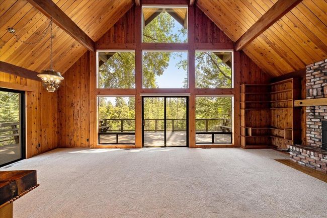 Clerestory windows welcome in an abundance of natural light and offer tranquil wooded views. | Image 22