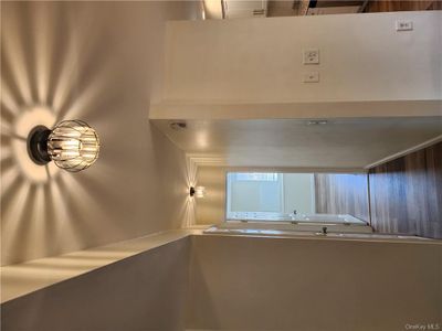 Corridor with dark hardwood / wood-style floors | Image 1