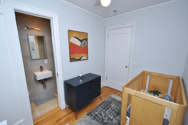 Third Bedroom has a renovated private bath with step in shower and can be used as a nursery, aupair room, office or den. | Image 27