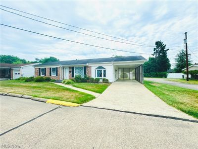 RIGHT SIDE VIEW OF HOME WITH CARPORT | Image 3