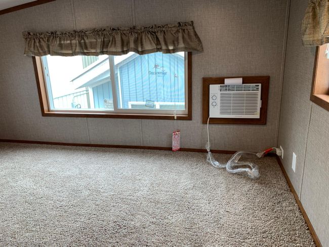 Another view of the loft area with a supplemental AC unit. | Image 15